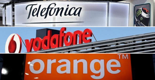 Los logos de las principales empresas de telecomunicaciones que operan en España: Telefónica, Vodafone y Orange. REUTERS/AFP