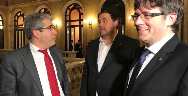 Francesc Homs, Oriol Junqueras y Carles Puigdemont, en el Parlament. E.P.