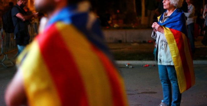 Decepción entre los asistentes tras la comparecencia de Puigdemont /Reuters