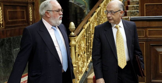 Cristóbal Montor y Miguel Arias Cañete./ EFE