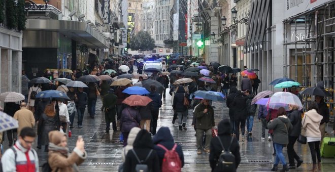 Lluvia en una calle de Madrid. EUROPA PRESS/Archivo