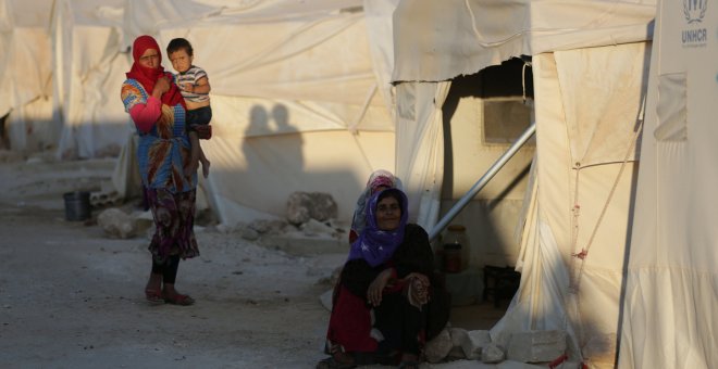 Mujeres en un campo de refugiados en Idlib, Siria. REUTERS/Khalil Ashawi