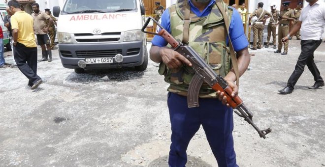 Security personal stand guard after a explosion hit at St Anthony's Church in Kochchikade in Colombo, Sri Lanka, 21 April 2019. According to the news reports at least 25 people killed and over 200 injured in a series of blasts during the Easter Sunday ser