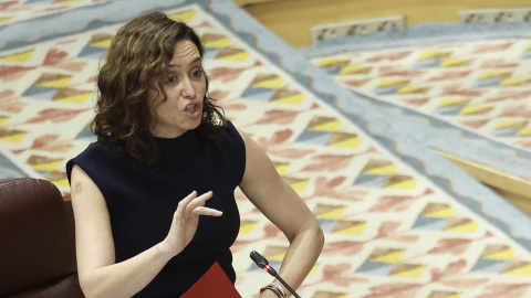La presidenta de la Comunidad de Madrid, Isabel Díaz Ayuso, interviene este jueves en el pleno de la Asamblea regional. La presidenta de la Comunidad de Madrid, Isabel Díaz Ayuso, interviene este jueves en el pleno de la Asamblea regional.
