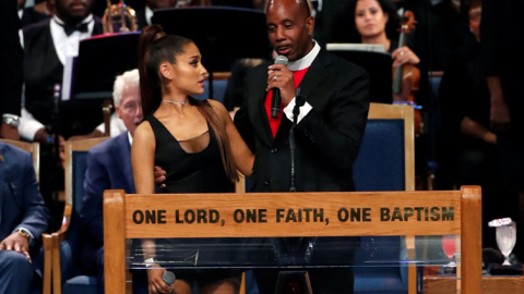 Pastor Charles speaks with singer Ariana Grande after she performed at the funeral service for Aretha Franklin at the Greater Grace Temple in Detroit