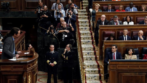 El líder de Unidas Podemos, Pablo Iglesias, interviene en la tribuna en la tercera jornada de la sesión de investidura en la que ha sido elegido presidente Pedro Sánchez. EFE/ Mariscal El líder de Unidas Podemos, Pablo Iglesias, interviene en la tribuna en la tercera jornada de la sesión de investidura en la que ha sido elegido presidente Pedro Sánchez. EFE/ Mariscal