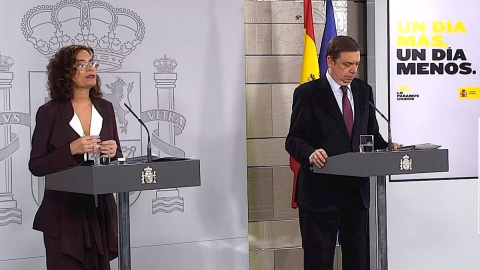 Captura de la señal institucional del Palacio de la Moncloa que muestra a la Ministra de Hacienda y Portavoz del Gobierno, María Jesús Montero (i), y al ministro de Agricultura, Pesca y Alimentación, Luis Planas (d). /EFE Captura de la señal institucional del Palacio de la Moncloa que muestra a la Ministra de Hacienda y Portavoz del Gobierno, María Jesús Montero (i), y al ministro de Agricultura, Pesca y Alimentación, Luis Planas (d). /EFE