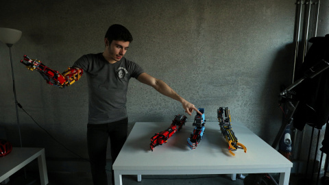 David Aguliar points at his prosthetic arms built with Lego pieces during an interview with Reuters in Sant Cugat del Valles, near Barcelona, Spain, February 4, 2019. Picture taken February 4, 2019. REUTERS/Albert Gea David Aguliar points at his prosthetic arms built with Lego pieces during an interview with Reuters in Sant Cugat del Valles, near Barcelona, Spain, February 4, 2019. Picture taken February 4, 2019. REUTERS/Albert Gea