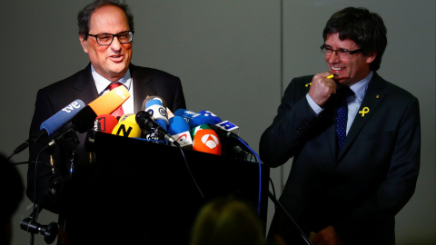El presindent de la Generalitat Quim Torra y su predecesor Carles Puigdemont, en una rueda de prensa en Berlín. REUTERS/Hannibal Hanschke El presindent de la Generalitat Quim Torra y su predecesor Carles Puigdemont, en una rueda de prensa en Berlín. REUTERS/Hannibal Hanschke