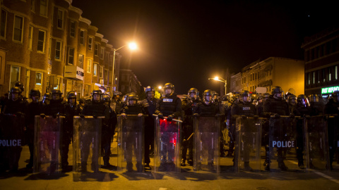 Police line up shortly before the deadline for a city-wide curfew passed in Baltimore. REUTERS/Eric Thayer