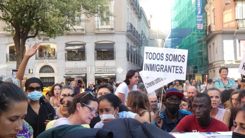 Un cartel apunta "todos somos migrantes". Un cartel apunta "todos somos migrantes".