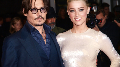 El actor Johnny Depp y su pareja Amber Heard. REUTERS