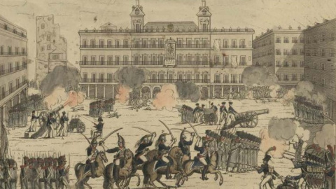 La Milicia Nacional defiende la plaza Mayor de Madrid del ataque de la Guardia Real. La Milicia Nacional defiende la plaza Mayor de Madrid del ataque de la Guardia Real.
