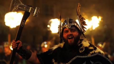 Up Helly Aa vikings from the Shetland Islands hold lit torches during the annual torchlight procession to mark the start of Hogmanay (New Year) celebrations in Edinburgh, Scotland December 30, 2014. The annual torchlight procession finishes