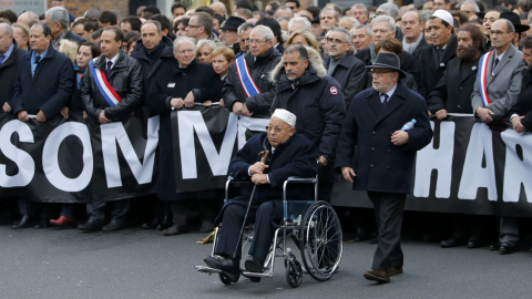 Paris Mosque rector Dalil Boubakeur (C), French political, religious and personalites take part in a solidarity march (Marche Republicaine) in the streets of Paris January 11, 2015. Hundreds of thousands of French citizens will be joined by