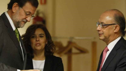 El presidente Mariano Rajoy junto a Soraya Saénz de Santamaría y Luis de Guindo. EUROPA PRESS El presidente Mariano Rajoy junto a Soraya Saénz de Santamaría y Luis de Guindo. EUROPA PRESS