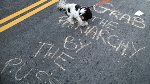 chalk slogan is seen on the road at the International Women's Day "A Day Without a Woman" anti-Trump protest in Los Angeles, California, U.S., March 8, 2017. REUTERS/Lucy Nicholson chalk slogan is seen on the road at the International Women's Day "A Day Without a Woman" anti-Trump protest in Los Angeles, California, U.S., March 8, 2017. REUTERS/Lucy Nicholson