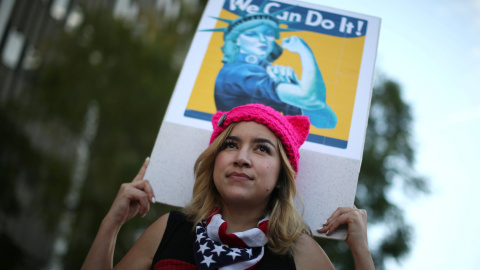 Kat Bembi, 35, participates in the International Women's Day "Day Without a Women" anti-Trump protest in Los Angeles, California, U.S., March 8, 2017. REUTERS/Lucy Nicholson Kat Bembi, 35, participates in the International Women's Day "Day Without a Women" anti-Trump protest in Los Angeles, California, U.S., March 8, 2017. REUTERS/Lucy Nicholson