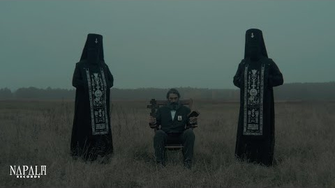 PATRIARKH - WIERSZALIN IV (feat. Eliza Sacharczuk) (Official Video) | Napalm Records New Patriarkh Album "PROPHET ILJA / ПРОРОК ИЛИЯ" out on January 3rd, 2025!
Pre-Order now: https://lnk.to/PATRIARKH-PROPHET-ILJA
music & lyrics by Patriarkh
mixed & mastered by Wojtek Wiesławski ( Hertz Studio )
produced by Варфоломей
directed & video by Hiatsyntos
Polish black metal icons PATRIARKH (formerly Batushka) embark on a dark and ominous pilgrimage as they unveil the next single from the upcoming concept album, ПРОРОК ИЛИЯ (Lat. PROROK ILJA), out on January 3, 2025 via Napalm Records. Accompanied by an official music video, the new song, entitled “ВЕРШАЛИН IV” (Lat. WIERSZALIN IV), weaves the sacred-inspired vocals of Eliza Sacharczuk with liturgical melodies, building into a storm of dark choirs and unforgettably intense harsh vocals.
Building on the critical success of Hospodi (2019) and relentless touring around the globe, PATRIARKH brings a renewed vision and profound storytelling to their Napalm Records debut. This eight-track journey immerses listeners in the true story of Eliasz Klimowicz, the enigmatic Prophet Ilja, set against the dramatic historical backdrop of the 1930s and ’40s. Deeply rooted in Eastern Orthodox traditions, PATRIARKH masterfully merges black and doom metal with haunting religious themes, conjuring an atmosphere as dark as it is mesmerizing.
Make sure to pre-order your copy of ПРОРОК ИЛИЯ (Lat. PROROK ILJA) now and check out the thrilling music video for “ВЕРШАЛИН IV” (Lat. WIERSZALIN IV) below!
PATRIARKH on the new single “ВЕРШАЛИН IV”:
“This is the most Oriental sounding song on our new album. The beautiful monody that runs throughout the entire piece is deeply influenced by Greek and Romanian traditions, which are integral to Orthodoxy. In our new music, we aim to showcase different aspects of Orthodoxy. Just as the Prophet Ilja journeyed to Kronsztadt, we traveled far for musical inspiration to create a psalm in honor of the New Jerusalem that our prophet was building.
This song features our long-time singing teacher, Eliza Sacharczuk. We have been collaborating with her since 2016, continuously improving our singing skills through lessons and consultations. Our choice was intentional; Eliza has a truly unique voice. Listen and see for yourself!"
PATRIARKH Live 2024
Asia & Australia Prophecy 2024
29.11.24 TH - Bangkok / Mr.Fox Livehouse
01.12.24 HK - Hong Kong / MOM Livehouse
03.12.24 CN - Shanghai / MAO Livehouse
04.12.24 CN - Beijing / Omnispace
06.12.24 KO - Seoul / West Bright Hall
07.12.24 TW – Taipei / Jack Studio
09.12.24 JP - Tokyo / Shibuya Club Asia
12.12.24 NZ - Auckland / Tuning Fork
13.12.24 AU - Melbourne / Max Watts
NOWY WIERSZALIN Poland 2025
03.01.25 PL - Łódź / Wytwórnia - SINFONIA ORTHODOXIA w/symphonic orchestra and male choir
22.02.25 PL - Krosno / Rock Klub Iron
07.03.25 PL - Wrocław / Transformator
08.03.25 PL - Zabrze / CK Wiatrak
09.03.25 PL - Kraków / HYPE PARK
14.03.25 PL - Lublin / Fabryka Kultury Zgrzyt
15.03.25 PL - Olsztyn / Scena Zgrzyt
16.03.25 PL - Warszawa / Klub Proxima
17.03.25 PL - Białystok / Zmiana Klimatu
21.03.25 PL - Gdynia / Podwórko.art
22.03.25 PL - Szczecin / Kosmos
23.03.25 PL - Poznań / 2progi