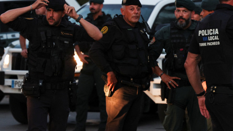 Police officers gather, amid anti-migrant unrest following an attack on an elderly man by unknown assailants earlier in the week, in Torre Pacheco, Spain, July 13, 2025. REUTERS/Violeta Santos Moura