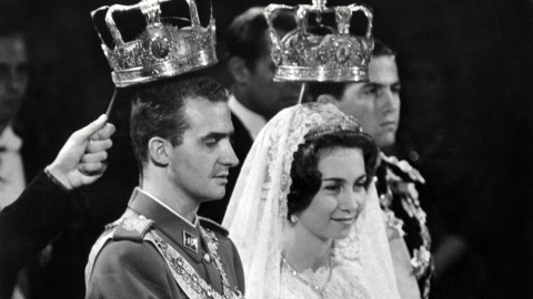 Prince Juan Carlos of Spain (Juan Carlos Alfonso Víctor María de Borbón y Borbón) and his wife princess Sophia of Greece, pictured 14 May 1962 in Athens during their wedding. Juan Carlos' grandfather Alfonso XIII was King of Spain until deposed in 1931 by the Second Spanish Republic. The Republic was ended by the Spanish Civil War and followed by the dictatorship of Francisco Franco, who ruled until his death 20 November 1975. Juan Carlos was designated King of Spain 22 November 1975. Queen Sofía was born in Athens 02 November 1938. She was the first daughter of King Paul I of Greece. Her family was forced to flee Greece during World War II. Prince Constantine of Greece is on the left, first row. AFP PHOTO (Photo by AFP)