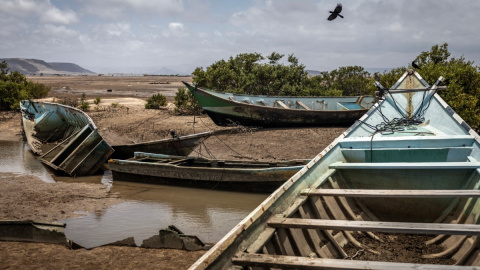 (FILES) Boats seized from smugglers attempting to transport migrants to Yemen are stored at a Coast Guard post in Khor Angar, on April 12, 2026. At least 109 migrants were killed, including 15 children, and some 116 were missing after a boat sank off the shores of Djibouti overnight on October 8-9, a UN agency said Sunday.Survivors said the vessel -- which was carrying 350 people from Djibouti to Yemen -- capsized north of the Djibouti town of Obock, according to a statement from the International Organization for Migration (IOM), whose teams are on the ground alongside local authorities to provide emergency aid. (Photo by Luis TATO / AFP)