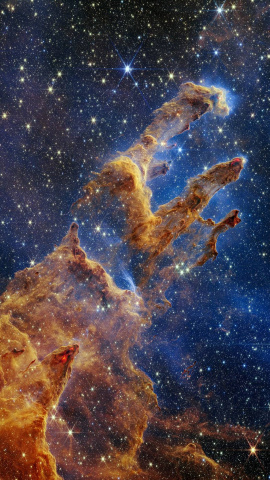 Los Pilares de la Creación se destacan en un caleidoscopio de colores en la vista de luz infrarroja cercana del telescopio espacial James Webb de la NASA. Los pilares parecen arcos y columnas que emergen de un paisaje desértico, pero están Los Pilares de la Creación se destacan en un caleidoscopio de colores en la vista de luz infrarroja cercana del telescopio espacial James Webb de la NASA. Los pilares parecen arcos y columnas que emergen de un paisaje desértico, pero están