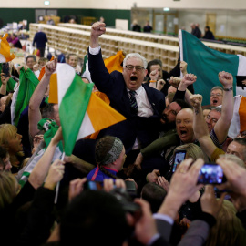 Sinn Fein candidate Thomas Gould celebrates with supporters after the announcement of voting results in a count centre, during Ireland's national election, in Cork, Ireland, February 9, 2020. REUTERS/Henry Nicholls