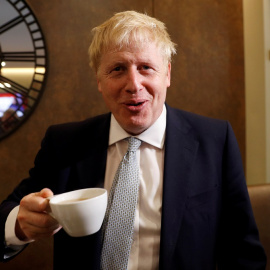 FILE PHOTO: Boris Johnson, a leadership candidate for Britain's Conservative Party, visits a tea shop in Oxshott