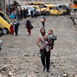  An Iraqi special forces soldiers walks through a house destroyed in an airstrike during a battle with Islamic State militants in Mosul. REUTERS/Goran Tomasevic