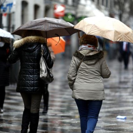 Personas con paraguas un día de lluvia.