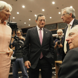 Christine Lagarde, Mario Draghi y Jean-Claude Juncker en una reunión informal del Eurogrupo en Nicosia (Chipre). AFP/ Yiannis Kourtoglou