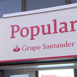 Los rótulos de las más de 1.200 oficinas de los bancos Popular y Pastor comienzan estos días a mostrar el color corporativo y la marca del Grupo Santander, su dueño desde junio.