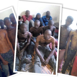 Personas migrantes retenidas en un campo de detención en la localidad de Sabha, en el sur de Libia. OIM