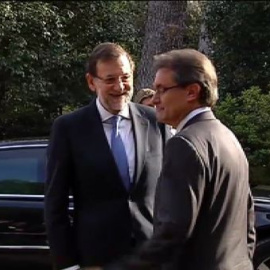 Rajoy apela a la unidad con Mas ausente