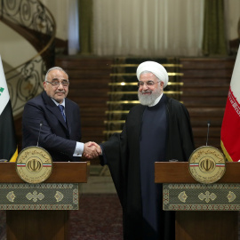 Iranian President Hassan Rouhani shake hands with Iraq's Prime Minister Adel Abdul Mahdi during a news conference in Tehran