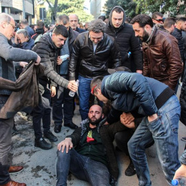 An injured protester is helped by others as supporters of Albanian opposition shout anti Government slogans during a protest in front of the government building in Tirana, Albania, 16 February 2019. Reports state that they are demanding the resignation of