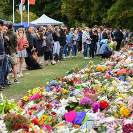 Members of the public visit at a makeshift memorial for the victims of the mosque mass murders at the Botanical Gardens in Christchurch, New Zealand, 17 March 2019. A gunman killed 50 worshippers at the Al Noor Masjid and Linwood Masjid on 15 March. A sus