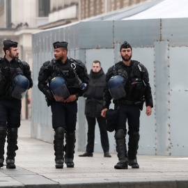 French gendarmes secure the Champs-Elysees avenue in front of the famed restaurant Fouquet's during the Act XIX (the 19th consecutive national protest on a Saturday) of the "yellow vests" movement in Paris