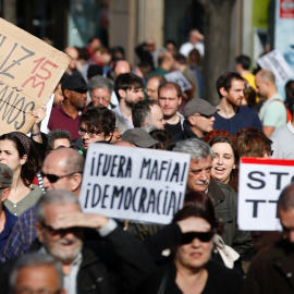 A man holds a placard reading "happy birthday 15M" during a march to mark the 5th anniversary of the "indignados" movement in Madrid, Spain, May 15, 2016. REUTERS/Sergio Perez