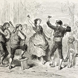 Un hombre y una mujer bailan una jota aragonesa tradicional.