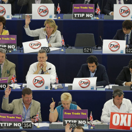 Members of the European Parliament with posters on the desks which read "no TTIP" take part in a voting session at the European Parliament in Strasbourg, France, July 7, 2015. The European parliament will vote on Wednesday on the E.U.-U.S. 