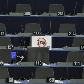 A poster which reads "no TTIP" is seen on the desk of a member of the European Parliament during a debate in Strasbourg, France, July 7, 2015. The European parliament will vote on Wednesday on the E.U.-U.S. Transatlantic Trade and Investmen