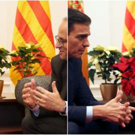 Pedro Sánchez y Quim Torra, durante su reunión, con más o menos flores.