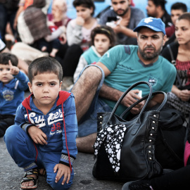 Inmigrantes sirios recién llegados a la isla de Kos, el 17 de agosto de 2015. AFP / LOUISA GOULIAMAKI