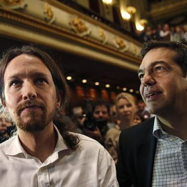 Pablo Iglesias y Alexis Tsipras, en un acto de Podemos en Madrid, en 2014.- REUTERS