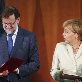 El presidente del Gobierno, mariano Rajoy, junto a al canciller alemana, Angela Merkel, en un encuentro en BerlÍn.- REUTERS