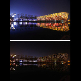 El Nido del Pájaro, en Pekín, antes y durante la hora del planeta. - EFE