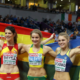 Beitia Ruth of Spain (L), Lithuania's Airine Palsyte and Ukraine's Yuliya Levchenko (R) pose with their national flags after competing in the Women's High Jump final at the European Athletics Indoor Championships in Belgrade, Serbia, 04 Mar