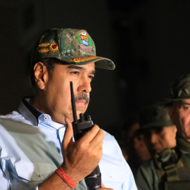 Venezuela's President Nicolas Maduro speaks on the radio accompanied by the Venezuela's Defense Minister Vladimir Padrino Lopez, on the day he says that his country would deploy military, police and civilian defenses at 284 "battlefront" locations across the country, amid heightened tensions with the U.S., in La Guaira, Venezuela, September 11, 2025. Miraflores Palace/Handout via REUTERS ATTENTION EDITORS - THIS IMAGE HAS BEEN SUPPLIED BY A THIRD PARTY